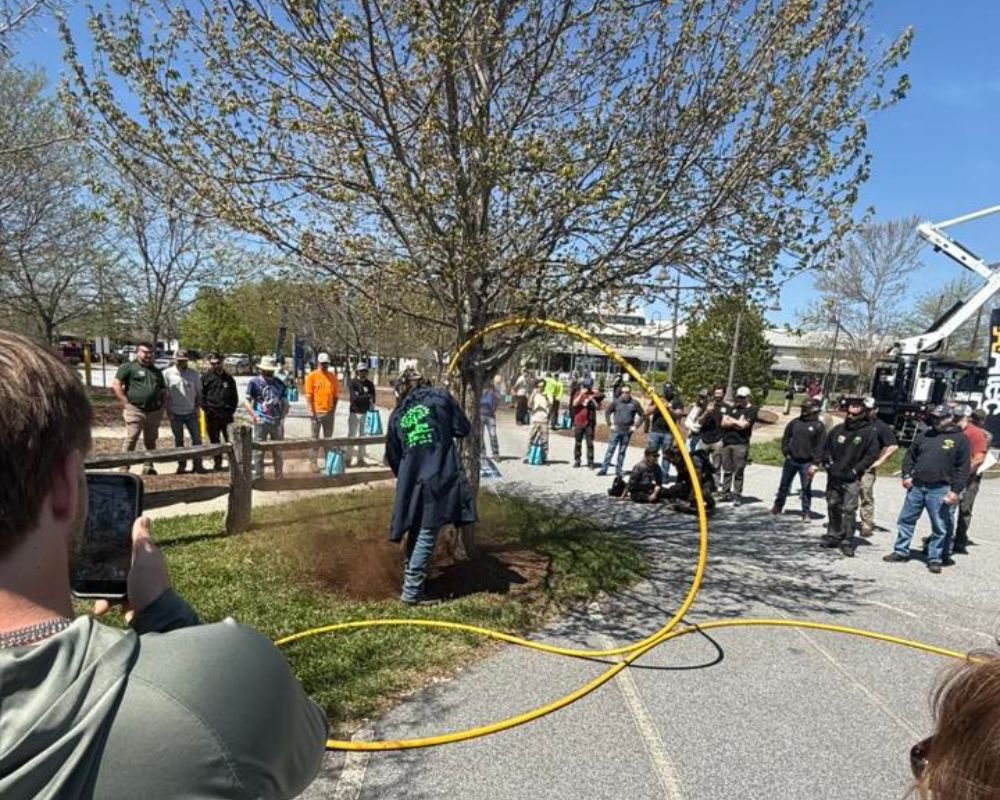 AirSpade equipment used for non-invasive soil and root excavation around trees.